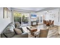 Comfortable living room with wood floors, patio access, and an adjacent dining area at 3457 Clark Rd # 156, Sarasota, FL 34231