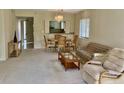 Open concept living space boasts dining area, comfortable seating, and a pass through to the kitchen at 3500 El Conquistador Pkwy # 129, Bradenton, FL 34210