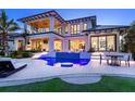 Outdoor living space with a custom pool, a spiral staircase, and an entertainment area at 424 Bowdoin Cir, Sarasota, FL 34236