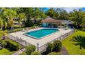Overhead view of a community pool, showcasing a fenced-in area with ample seating at 4463 Atwood Cay Pl # 22, Sarasota, FL 34233