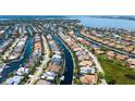 Beautiful aerial view showcases waterfront living with homes lining the canal at 4741 Pinnacle Dr, Bradenton, FL 34208