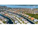 Stunning aerial view of a waterfront community with canals, homes, and lush landscaping at 4741 Pinnacle Dr, Bradenton, FL 34208