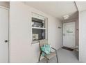 Inviting front porch with a decorative welcome sign, perfect for enjoying the outdoors at 5647 Sheffield Greene Cir # 29, Sarasota, FL 34235