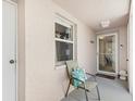 Charming front porch with beach decor and comfortable seating, welcoming guests to this cozy home at 5647 Sheffield Greene Cir # 29, Sarasota, FL 34235