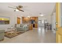 Open-concept living room and kitchen with wood cabinets and a view of the front door at 568 Sheridan Dr, Venice, FL 34293