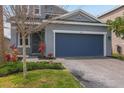 Charming two-story home with an attached two-car garage and landscaping at 5759 Bungalow Grove Ct, Palmetto, FL 34221