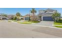 A neighborhood street view with well-maintained homes and manicured lawns at 5759 Bungalow Grove Ct, Palmetto, FL 34221