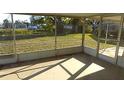 Enclosed lanai overlooking the serene backyard and tranquil water feature at 6309 35Th W Ave, Bradenton, FL 34209