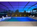 Beautiful outdoor pool with lounge seating and landscape lighting perfect for relaxation at 8163 Redonda Loop, Lakewood Ranch, FL 34202