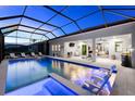 Beautiful view of the pool and outdoor seating area, perfect for evening relaxation at 8163 Redonda Loop, Lakewood Ranch, FL 34202