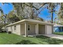 Single-story home featuring durable siding, landscaped yard, and easy driveway access at 842 31St E Ave, Bradenton, FL 34208