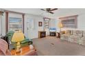 Comfortable living room featuring plush seating and a wall-mounted television at 1212 41St Avenue E Dr, Ellenton, FL 34222