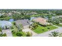 Attractive home features a well-maintained lawn, mature trees, and a tranquil lake in the backyard at 1727 88Th Nw Ct, Bradenton, FL 34209