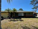 Charming home featuring palm trees, a well-maintained lawn, and inviting curb appeal at 2712 52Nd Avenue W Ter, Bradenton, FL 34207