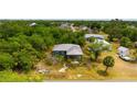 Aerial view of the home showcasing its location and surrounding lush greenery at 3320 Audette St, Port Charlotte, FL 33948