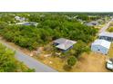 Aerial view of a home nestled amongst lush greenery at 3320 Audette St, Port Charlotte, FL 33948
