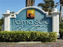 Palma Sola Bay Club sign with lush landscaping providing a welcoming entrance to the community at 3420 77Th W St # 202, Bradenton, FL 34209