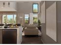 Bright living room with tall ceilings, neutral tones, and large windows offering a view of the outdoors at 3811 30Th S Ave, St Petersburg, FL 33711