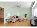 Comfortable living room with hardwood floors, ceiling fan, and plenty of natural light at 3917 Ashwood Ln # 57, Sarasota, FL 34232