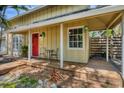 Cozy front porch with seating area, creating a welcoming entrance to the home at 4063 Woodview Dr, Sarasota, FL 34232