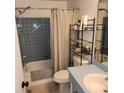 Cozy bathroom featuring a shower-tub combo and classic fixtures at 4070 Grobe St, North Port, FL 34287