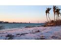 Scenic beach view featuring calm turquoise water and serene sandy shoreline at sunset at 4214 Higel Ave, Sarasota, FL 34242