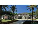Elegant home exterior with well-maintained gardens, a charming guesthouse, and a spacious layout at 4214 Higel Ave, Sarasota, FL 34242