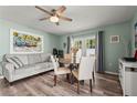 Dining area featuring a round table, cozy seating, and artwork, bathed in natural light at 4311 2Nd E Ave, Bradenton, FL 34208
