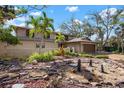 Beautiful two-story home with tropical landscaping and water feature at 4711 Ocean Blvd, Sarasota, FL 34242