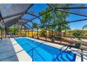 The spacious screened-in pool offers a refreshing escape with ample space for lounging and entertaining at 5404 4Th Avenue Nw Dr, Bradenton, FL 34209