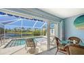 Bright dining room with scenic views of the pool, patio and backyard at 7664 Camminare Dr, Sarasota, FL 34238