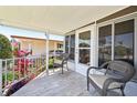Cozy porch area with comfortable seating, perfect for enjoying the outdoors and neighborhood views at 8534 Imperial Cir, Palmetto, FL 34221