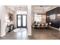 Stylish entry with brick wall detail flowing into a beautifully decorated dining area at 1007 143Rd Ne St, Bradenton, FL 34212