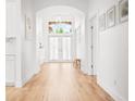 Welcoming foyer with tile flooring and arched doorway entrance at 1189 Fraser Pine Blvd, Sarasota, FL 34240