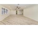 Bright living room with lots of space and a neutral color scheme, ceiling fans, and recessed lighting at 2601 13Th W St, Palmetto, FL 34221