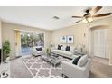 Comfortable living room featuring a ceiling fan, balcony access, and a relaxing atmosphere at 2839 Swifton Dr # 28, Sarasota, FL 34231