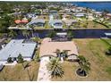 Expansive aerial view shows a single Gathering home with canal access near other waterfront homes at 3069 Stone St, Port Charlotte, FL 33981