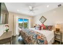 Cozy bedroom features a ceiling fan, balcony access, and a serene atmosphere at 336 Avenida De Mayo, Sarasota, FL 34242
