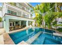 Inviting pool with a spa, surrounded by lush greenery for ultimate relaxation at 336 Avenida De Mayo, Sarasota, FL 34242