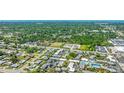 An aerial view of the real estate and surrounding area and roads near a power station at 4001 Beneva Rd # 343, Sarasota, FL 34233