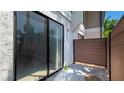 Private outdoor patio featuring modern privacy fences and views of the surrounding landscaping at 4001 Beneva Rd # 343, Sarasota, FL 34233