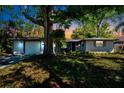 Charming single-story home with a well-manicured lawn and mature tree offering plenty of shade at 4806 Capri Ave, Sarasota, FL 34235