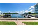 Scenic waterfront view of the harbor from the property, with boat docks and lush greenery at 605 Sutton Pl # 401-A, Longboat Key, FL 34228