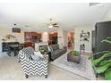 Spacious living area seamlessly connecting the kitchen and dining area, great for entertaining at 6723 Trent Creek Dr, Sun City Center, FL 33573