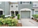 Charming townhome features a well-manicured landscape, a covered entryway, and an attached single-car garage at 7180 83Rd E Dr # 6-5, Bradenton, FL 34201