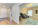 Cozy living room with hardwood floors, comfortable seating, and natural light at 12738 Hysmith Loop, Parrish, FL 34219