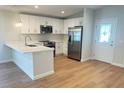 Bright kitchen with a breakfast bar, stainless steel appliances, and modern cabinetry at 1428 19Th St, Sarasota, FL 34234