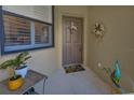 Welcoming front porch with decorative plants, wreath, and sunflower mat at 2064 Batello Dr, Venice, FL 34292