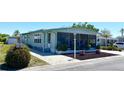 Inviting home with a screened-in porch and landscaped front yard at 217 Water Oak Ln, Sarasota, FL 34237
