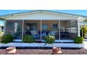 A cozy screened porch provides an excellent area for relaxation at 217 Water Oak Ln, Sarasota, FL 34237